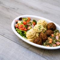 Hummus Bowl · Chickpea hummus with warm falafel, tabbouleh, spring mixed greens, cucumber-tomato salad and...