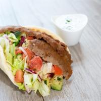Classic Pita Sandwich · Hand-carved gyro or grilled chicken, lettuce, cucumber-tomato salad, red onion, lettuce, Gre...