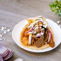 Cali Pita · hand-carved gyros or grilled chicken, fire feta, onions, tzatziki and french fries on warm p...