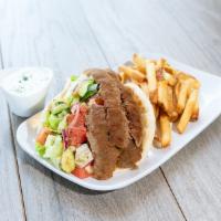 Classic Pita Sandwich Combo · Choice of hand-carved gyro or grilled chicken, cucumber-tomato salad, red onion, lettuce, Gr...