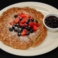 Signature Oatmeal Pancake · Our extra-large gluten friendly pancake made with freshly ground rolled oats and topped with...
