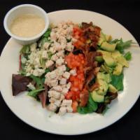 Cobb Salad · Ham, turkey, bacon, avocado, cheddar jack, tomato, mixed greens served with your choice of d...