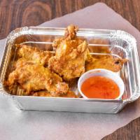Bangkok Wings · Crispy chicken wings with sweet chili dip.