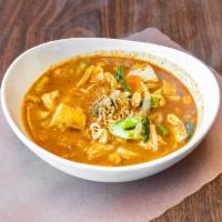 Massaman Curry · Served with onion, peanuts and potato in coconut milk.