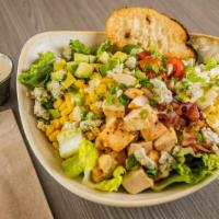 Cobb Salad · Mixed greens with grilled chicken, bacon, hard-boiled egg, cucumbers, and tomatoes.