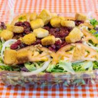 Picasso NW Salad · Mixed greens with tomatoes, sliced onions, dried cranberries, sunflower seeds, croutons and ...