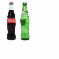 Soda in a glass bottle · Coke or Fanta