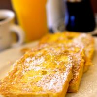 Soudough French Toast · Served with whipped butter and warm maple syrup.