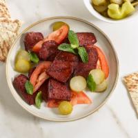 Soujouk · Ground beef sausage with special spices. Served with pickles and pita.