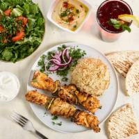 Chicken Kebab · 2 Skewers. Grilled chicken breast chunks marinated with garlic and spices. Served with rice,...