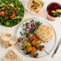 Veggie Kebab · 3 Skewers. Grilled mushrooms, Italian squas and red bell peppers.  Served with rice, hummus,...