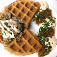 Carnitas Waffle · Topped with slow cooked, perfectly seasoned pulled pork, chipotle crema, salsa verde, cojita...