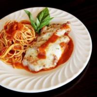 Chicken Parmigiana · Chicken breast lightly breaded, baked with tomato sauce and topped with mozzarella cheese