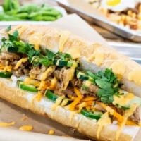 Banh Mi Sandwich · A crispy Baguette bread filled with your choice of protein, cucumbers, Pickled carrots and d...