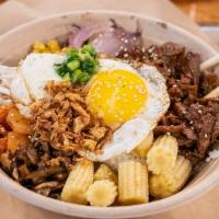 Bibimbap · Literally means mixed rice. Slow braised Korean inspired sliced beef with white rice and sau...