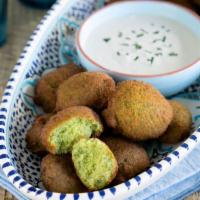 Falafel · Served with romaine lettuce, cherry tomatoes, and tahini sauce. Vegetarian.