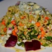 Quinoa Roasted Beet Salad · Served with red radish, carrots, red onion, mint, and gorgonzola cheese in a lemon honey vin...
