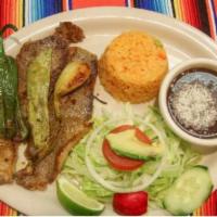 Carne Asada Platillo · Grilled beef served with rice and beans, a small side salad and corn tortillas 