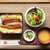Grilled Eel Bento Box · Grilled fillet of eel over a bed of rice, eel sauce on top, pickles, miso soup. 