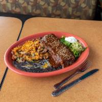 Poblana Chimichanga Dinner · Slow-cooked, secretly seasoned pork with pico de gallo, Pueblan mole sauce and queso fresco....