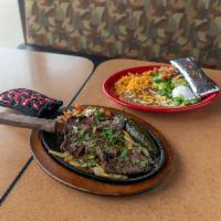 Carne Asada Borracha Dinner · Drunken skirt steak. Skirt steak marinated in beer and lime juice then grilled to perfection...