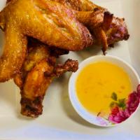 11. Fried Chicken Wings · Marinated fried chicken wings with Thai seasoning.