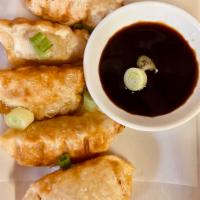 12. Gyoza · 5 pieces. Wonton wrappers stuffed with pork and cabbage.