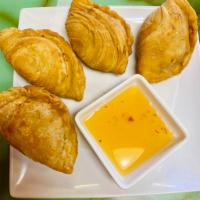 14. Chicken Curry Puff · 3 pieces. Pastry dough filled with curried potatoes and chopped chicken meat.