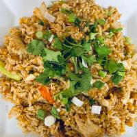 32. Thai Fried Rice · Yellow onion, green onion, egg, and tomatoes.