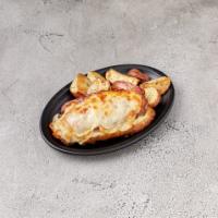 Ham Croissant · Tasty croissant with ham, bechamel sauce and mozzarella cheese on top meticulously baked in ...