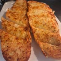 Garlic Bread ·  Buttery bread that is topped with garlic. 
