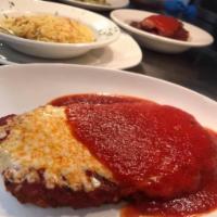 Veal Parmigiana                      · Side of pasta with tomato sauce.