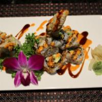 Spider Roll · Soft shell crab, avocado, cucumber inside and fresh mango on top.