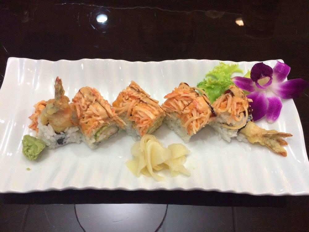 Snow White Roll · Shrimp tempura and avocado inside, spicy crunch kani on top. Raw. Spicy.