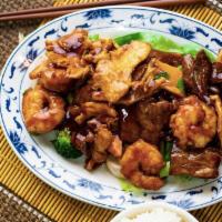 Triple Delight · Chicken, shrimp, and beef stir fried with mixed vegetables in chef's brown sauce.