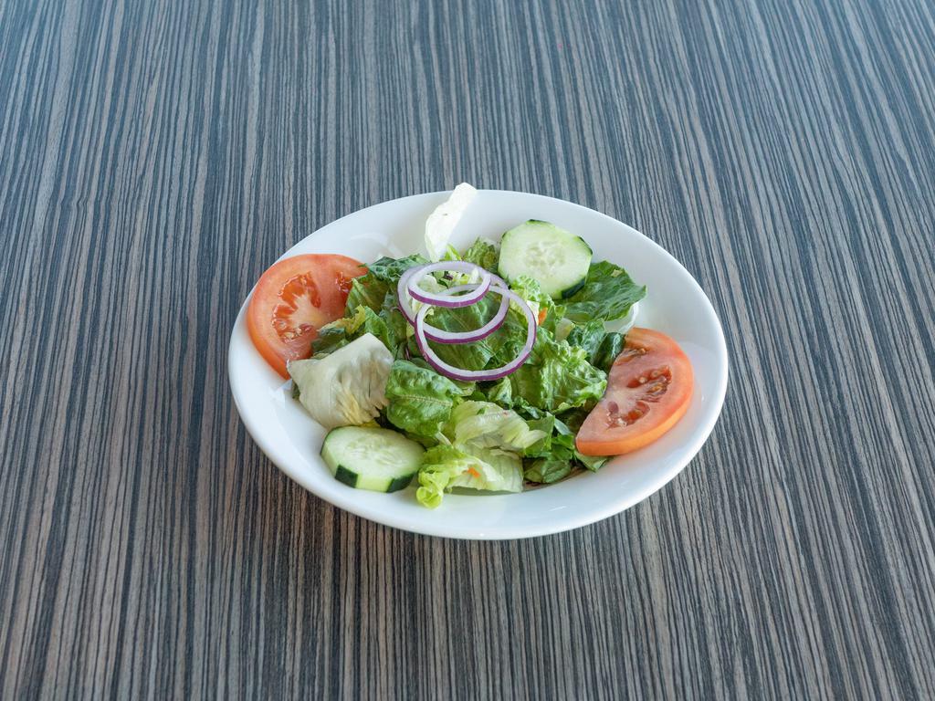 Chef Salad · House mixed greens, tomatoes, sliced cucumber, ham and diced egg. Topped off with our American and Swiss blend.