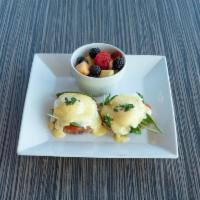 Classic Benedict · 2 poached eggs on a toasted English muffin, Canadian bacon, and topped with our in house mad...