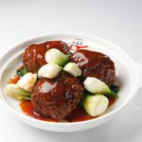 Braised Meatball with Crab Meat 紅燒蟹粉獅子頭 · Lightly browned in fat and then cooked slowly in a closed pan with a small amount of liquid.