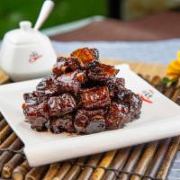 Sweet and Sour Ribs 糖醋小排 · Cooked with or incorporating both sugar and a sour substance.
