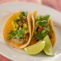 Crispy Fish Tacos · Tomato-avocado salsa, napa cabbage, chipotle sauce and flour or corn tortillas. Served with ...