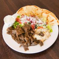 Lamb Plate · A mixture of lamb and beef served with hummus topped with olive oil, green salad, feta chees...