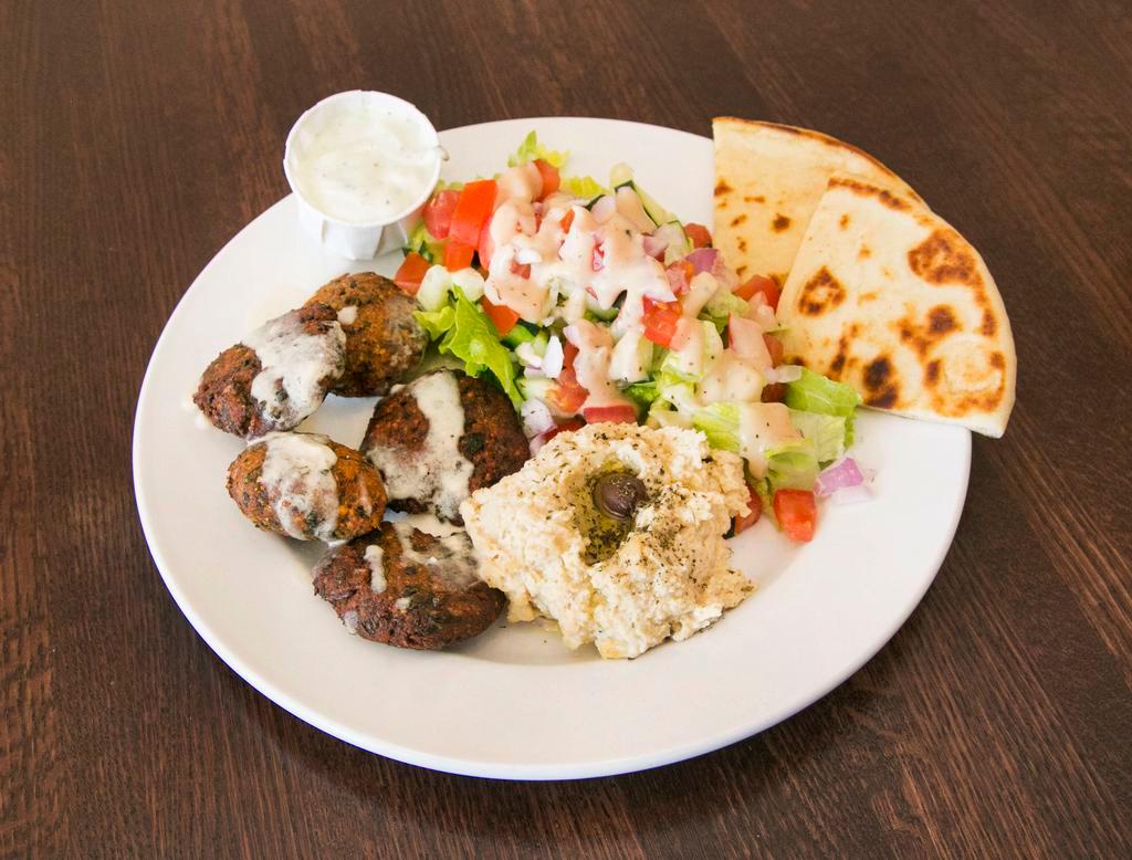 Falafel Plate · 5 pieces of falafel with side salad, hummus, 1/2 pita bread and tahini sauce.