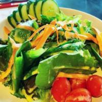 House Salad · Mixed field greens, grape tomatoes, and cucumber served with our house-made dressing. Dairy ...