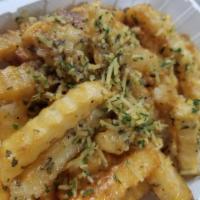 Garlic Fries · Vegetarian. Topped  with our garlic butter sauce, roasted garlic, Parmesan cheese and a side...