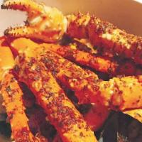 King Crab legs · 1 pound of king crab legs steamed and dressed with your choice of one of our famous sauces! ...