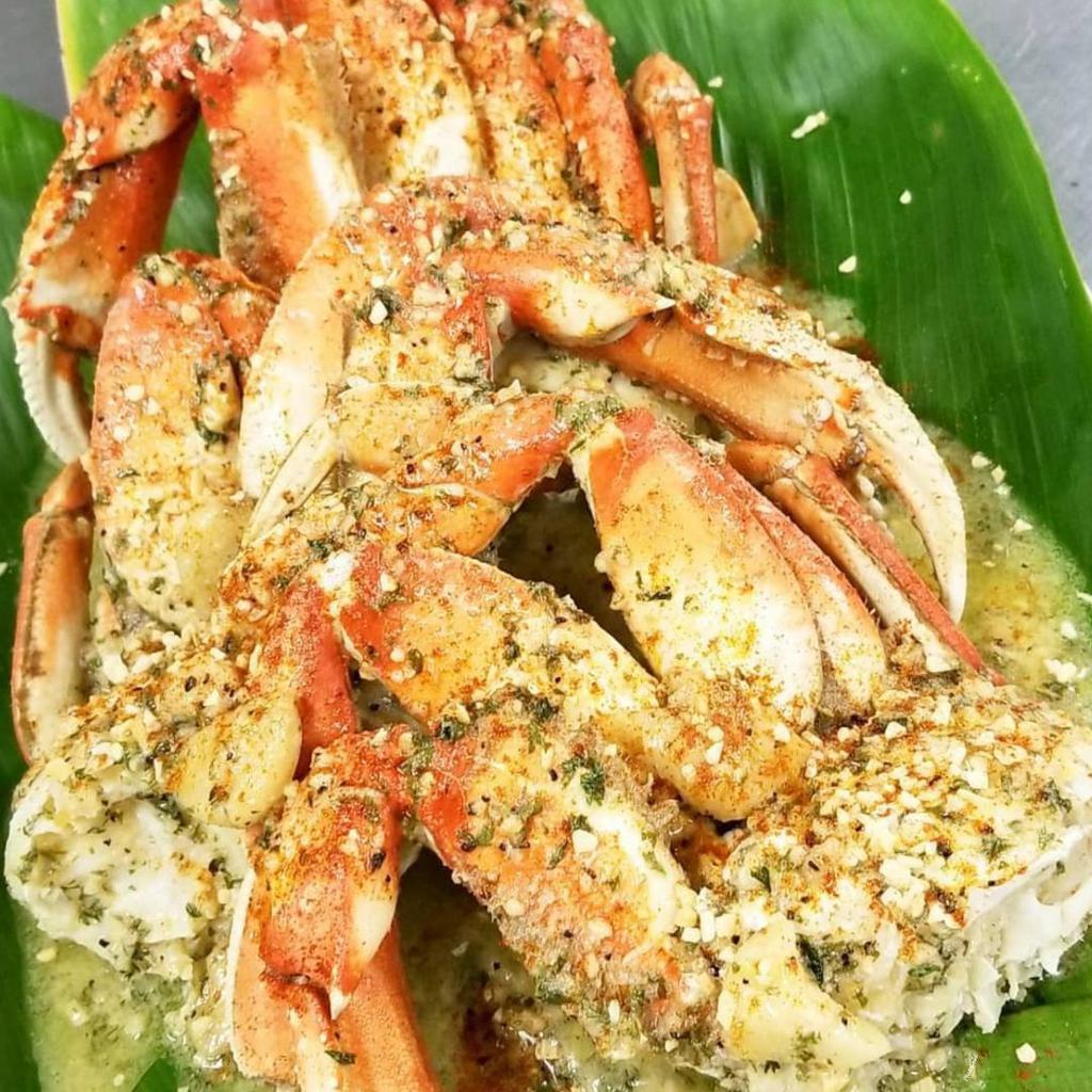 Dungeness Crab Clusters (legs only) · 1 pound of Dungeness crab leg clusters steamed and dressed with your choice of one of our famous sauces!