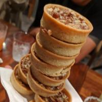 House Made Pecan Tarts · 3 house made mini pecan tarts served with freshly made whipped cream. **Contains nuts.