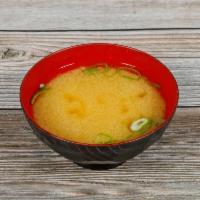 Miso Soup · Served with tofu and green onions.