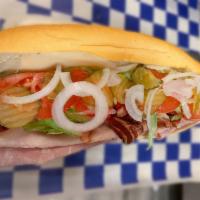 The Club Sub · Ham, smoked turkey, bacon and provolone cheese (mayo, lettuce, tomato, onion, pickle).