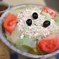 Greek Salad · Topped with feta cheese.